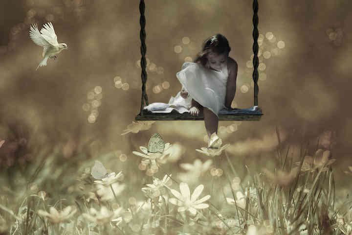 Young girl on swing